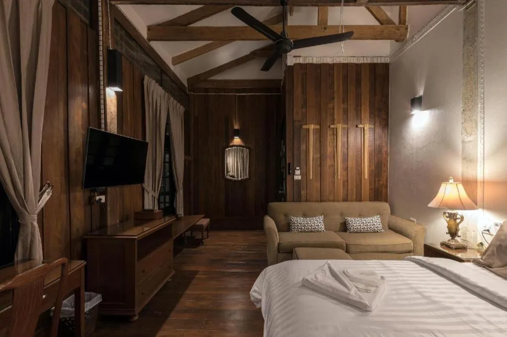 Bed in Uthai Heritage Hotel