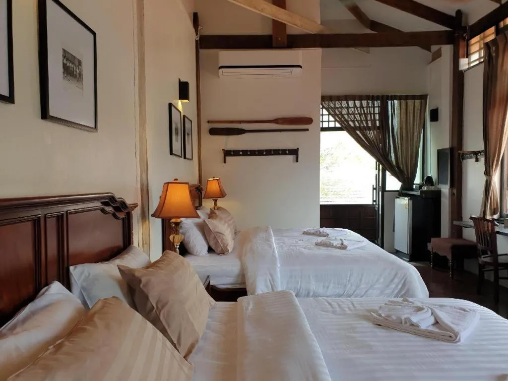 Bed in Uthai Heritage Hotel