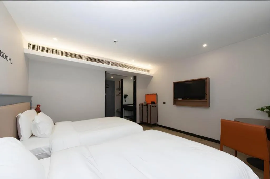 Bed in Premier City Comfort Hotel Yangzhou Shouxi Lake West Gate Weiyang Road Siji Garden