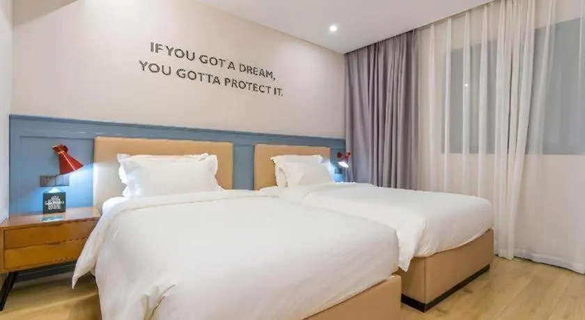 Bed in Premier City Comfort Hotel Yangzhou Shouxi Lake West Gate Weiyang Road Siji Garden