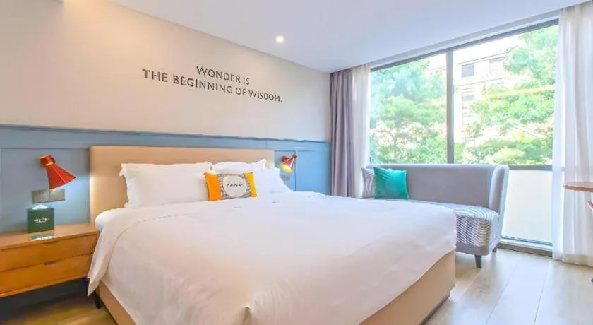 Bed in Premier City Comfort Hotel Yangzhou Shouxi Lake West Gate Weiyang Road Siji Garden