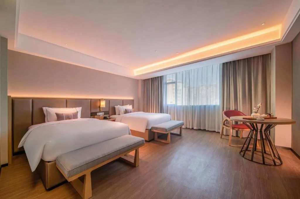 Bed in Echeng Hotel Hezhou Shizheng Square