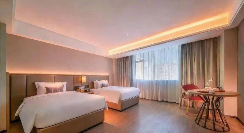 Bed in Echeng Hotel Hezhou Shizheng Square