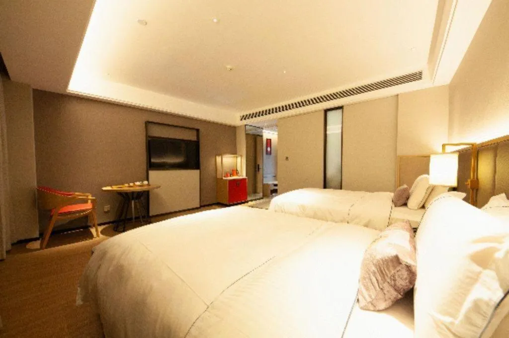 Bed in Echeng Hotel Hezhou Shizheng Square