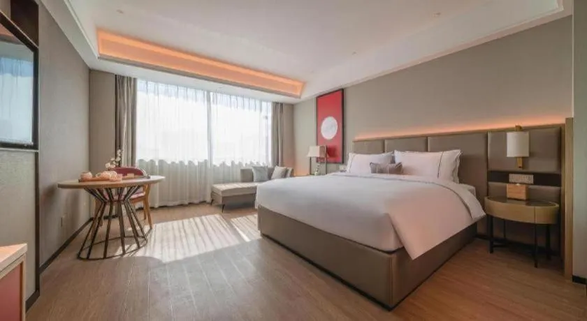 Bed in Echeng Hotel Hezhou Shizheng Square