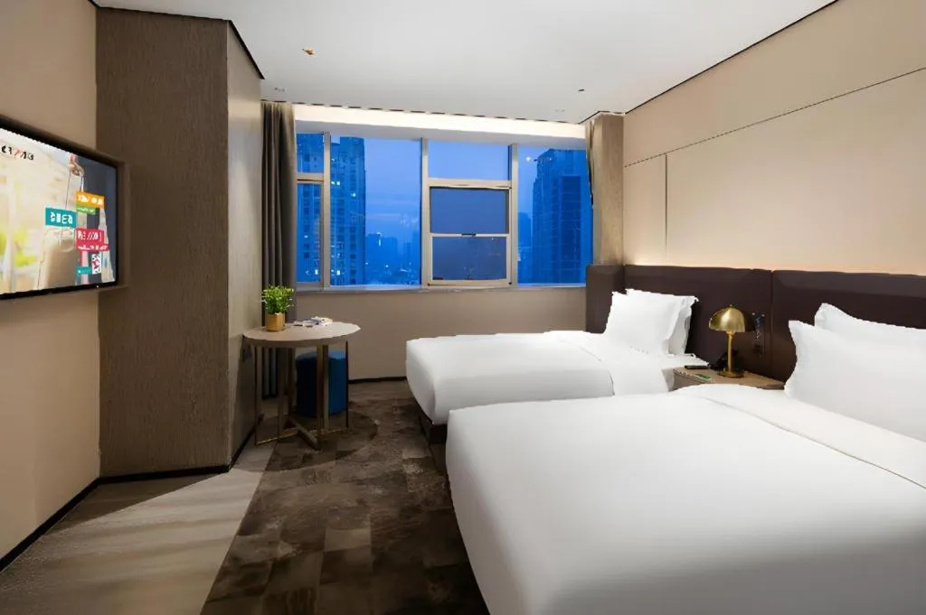 Bed in Echarm Plus Hotel Hangzhou Binjiang Xingguang Avenue