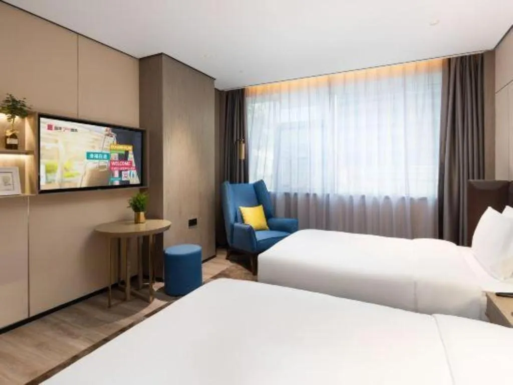 Bed in Echarm Plus Hotel Hangzhou Binjiang Xingguang Avenue