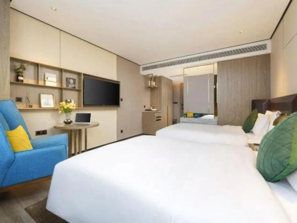 Bed in Echarm Plus Hotel Hangzhou Binjiang Xingguang Avenue