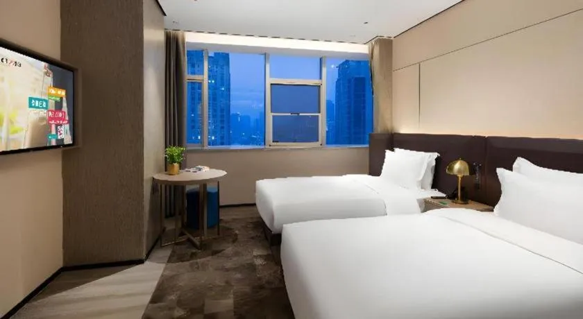 Bed in Echarm Plus Hotel Hangzhou Binjiang Xingguang Avenue