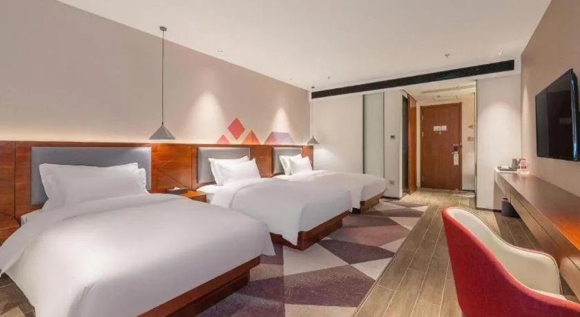 Bed in Borrman Hotel Guilin North Railway Station Zhonghao International