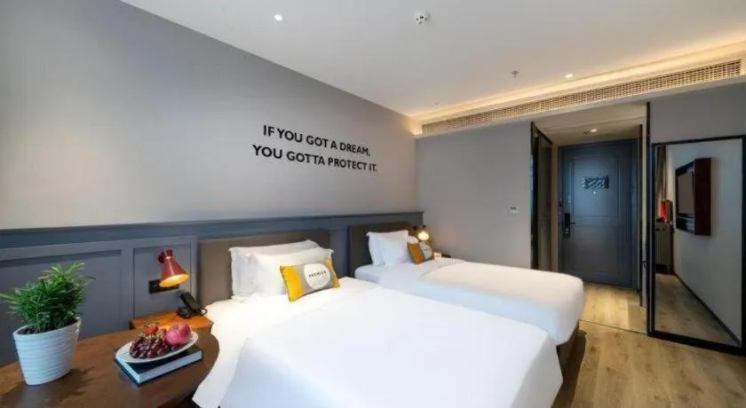 Bed in Premier City Comfort Hotel Suizhou Wuyue Plaza