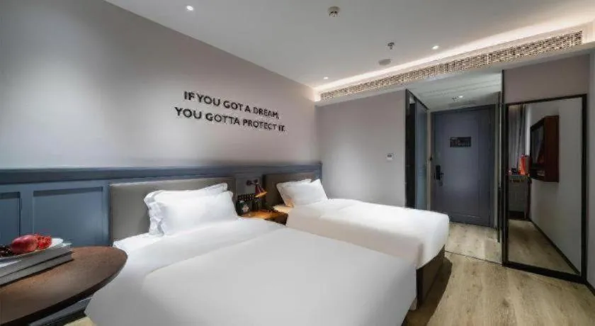 Bed in Premier City Comfort Hotel Suizhou Wuyue Plaza