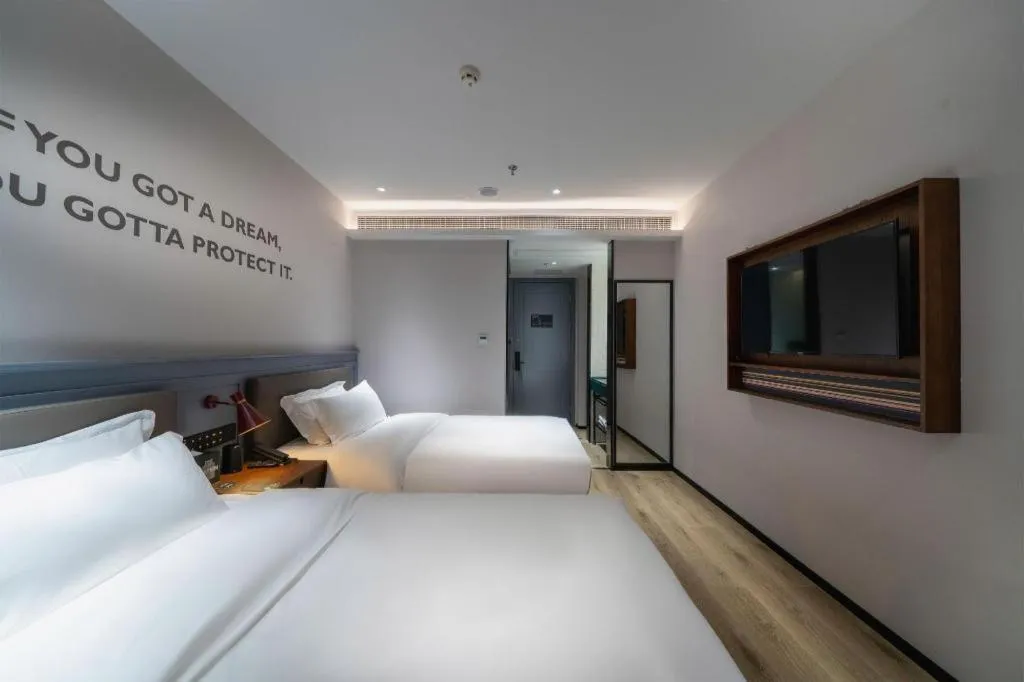 Bed in Premier City Comfort Hotel Suizhou Wuyue Plaza