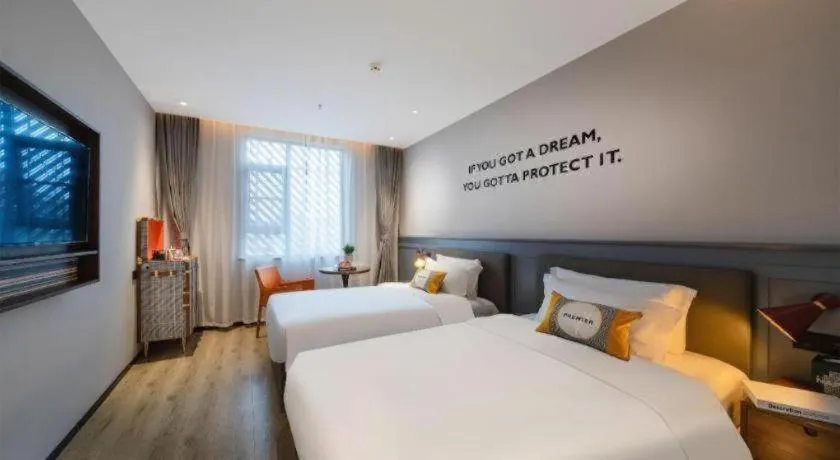 Bed in Premier City Comfort Hotel Suizhou Wuyue Plaza