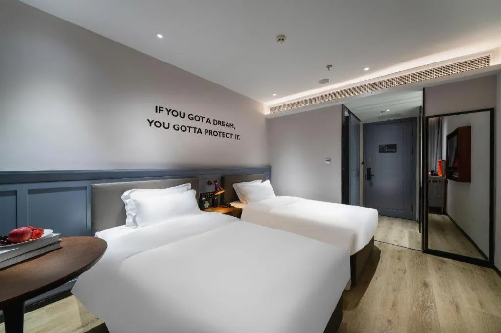 Bed in Premier City Comfort Hotel Suizhou Wuyue Plaza