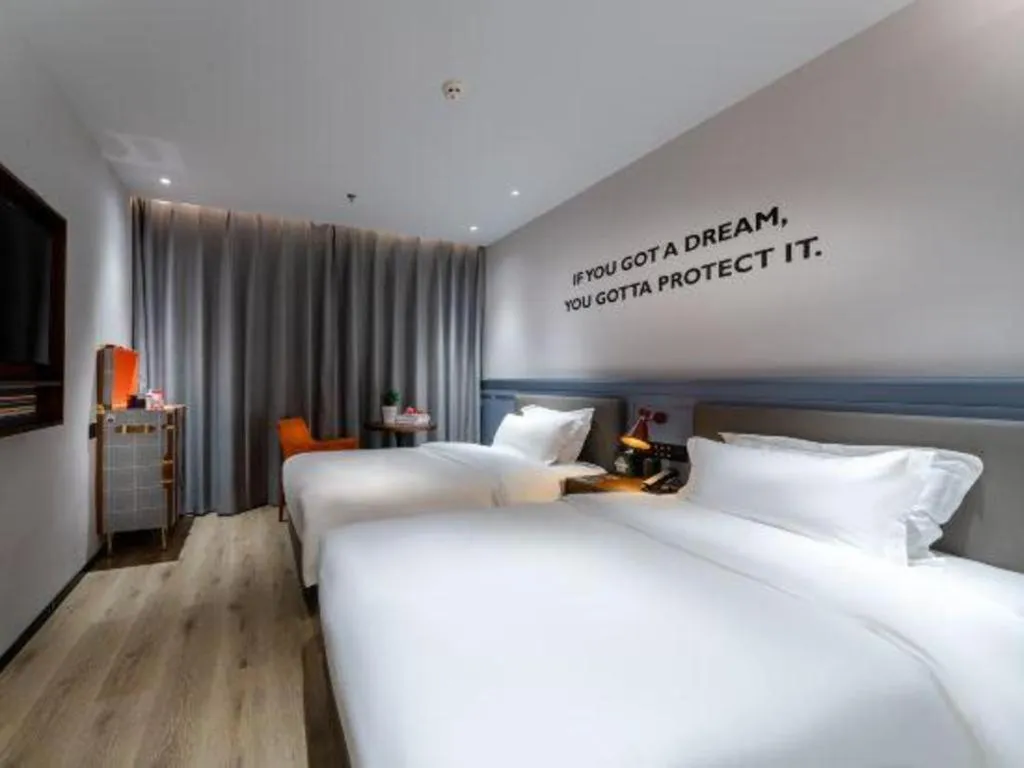 Bed in Premier City Comfort Hotel Suizhou Wuyue Plaza
