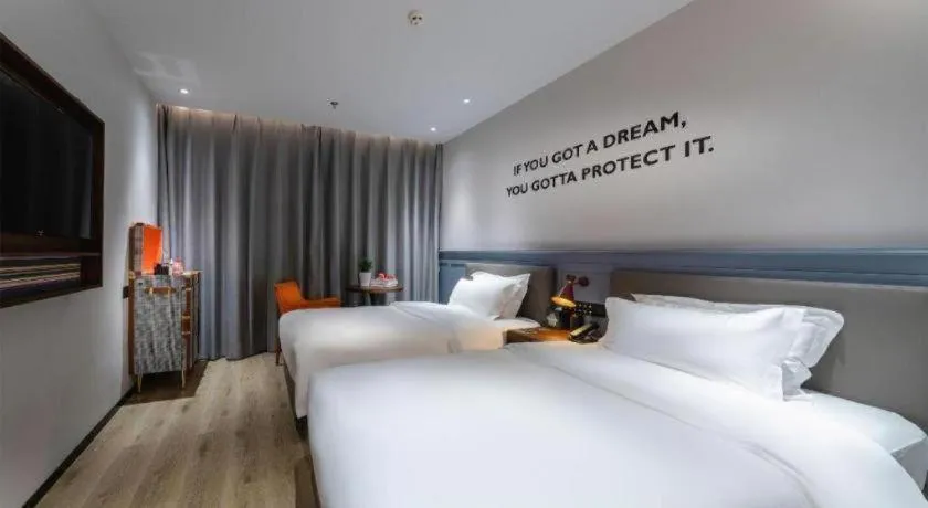 Bed in Premier City Comfort Hotel Suizhou Wuyue Plaza