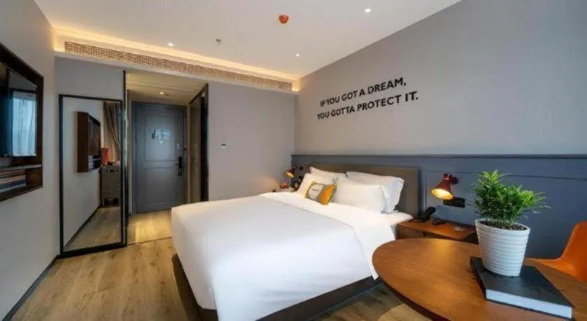 Bed in Premier City Comfort Hotel Suizhou Wuyue Plaza