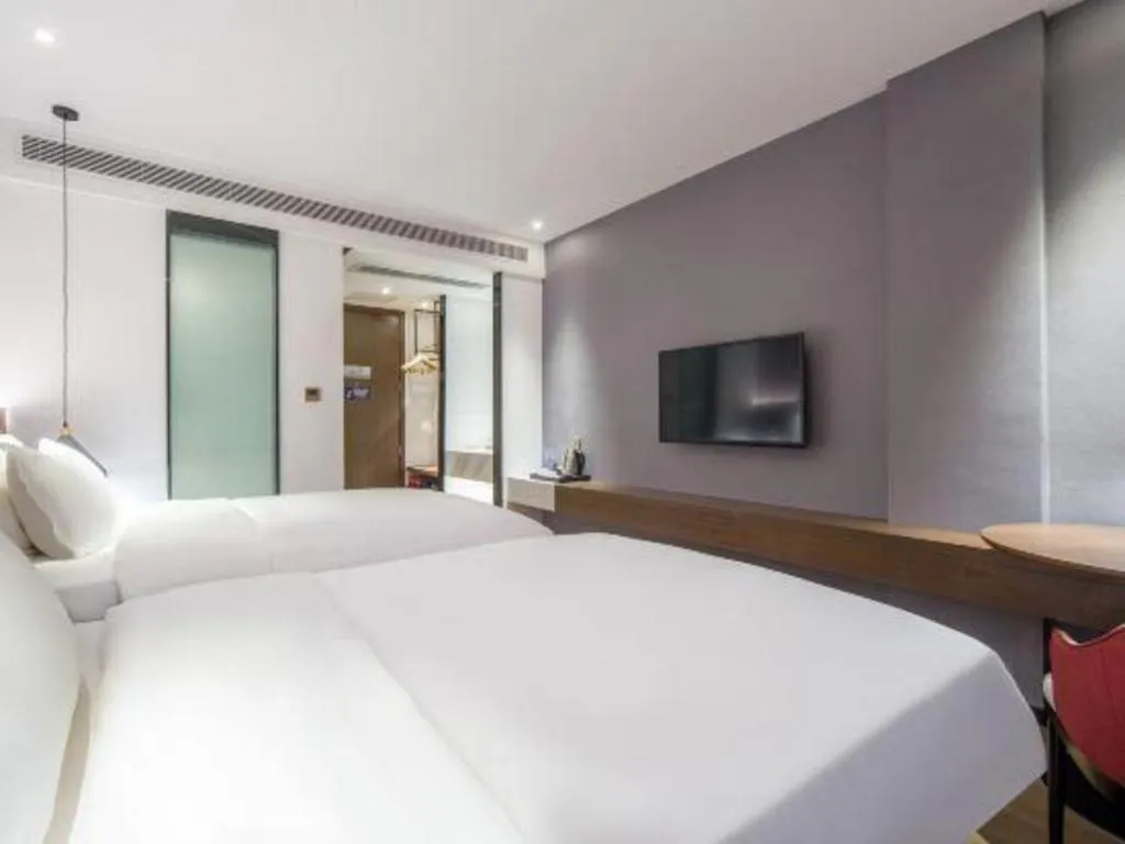 Bed in Borrman Hotel Wuzhou Teng County