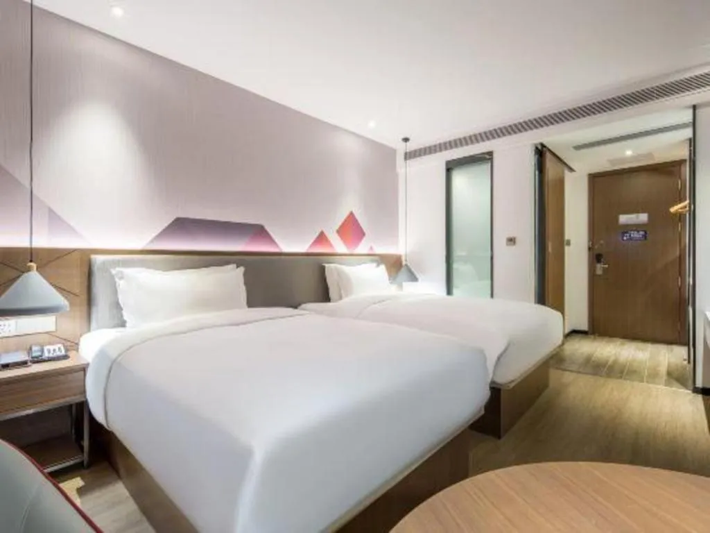Bed in Borrman Hotel Wuzhou Teng County