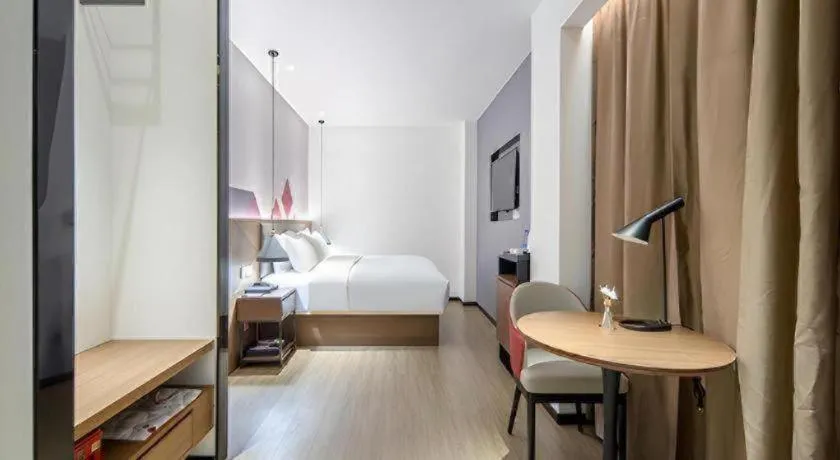 Bed in Borrman Hotel Wuzhou Teng County