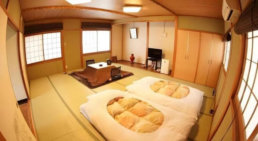 Bed in Hotel Miyoshino Annex