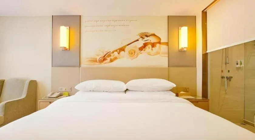 Bed in Vienna Hotel Zhengzhou East High-Speed Railway Station