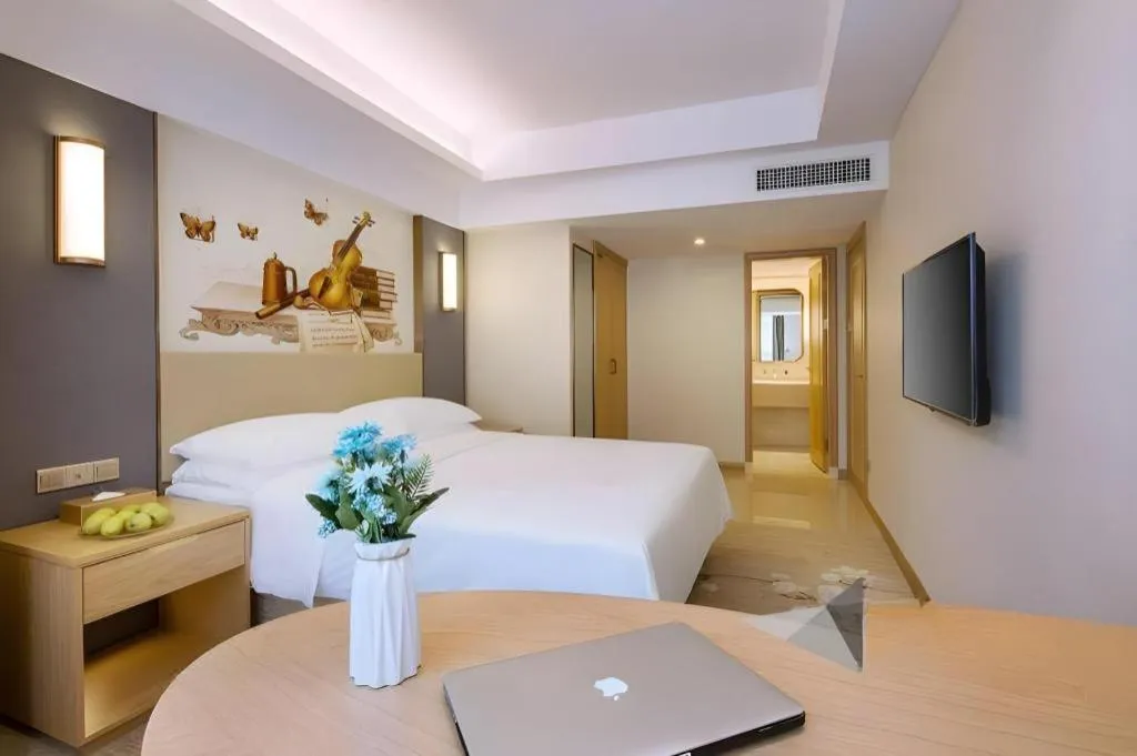 Bed in Vienna Hotel Zhengzhou East High-Speed Railway Station