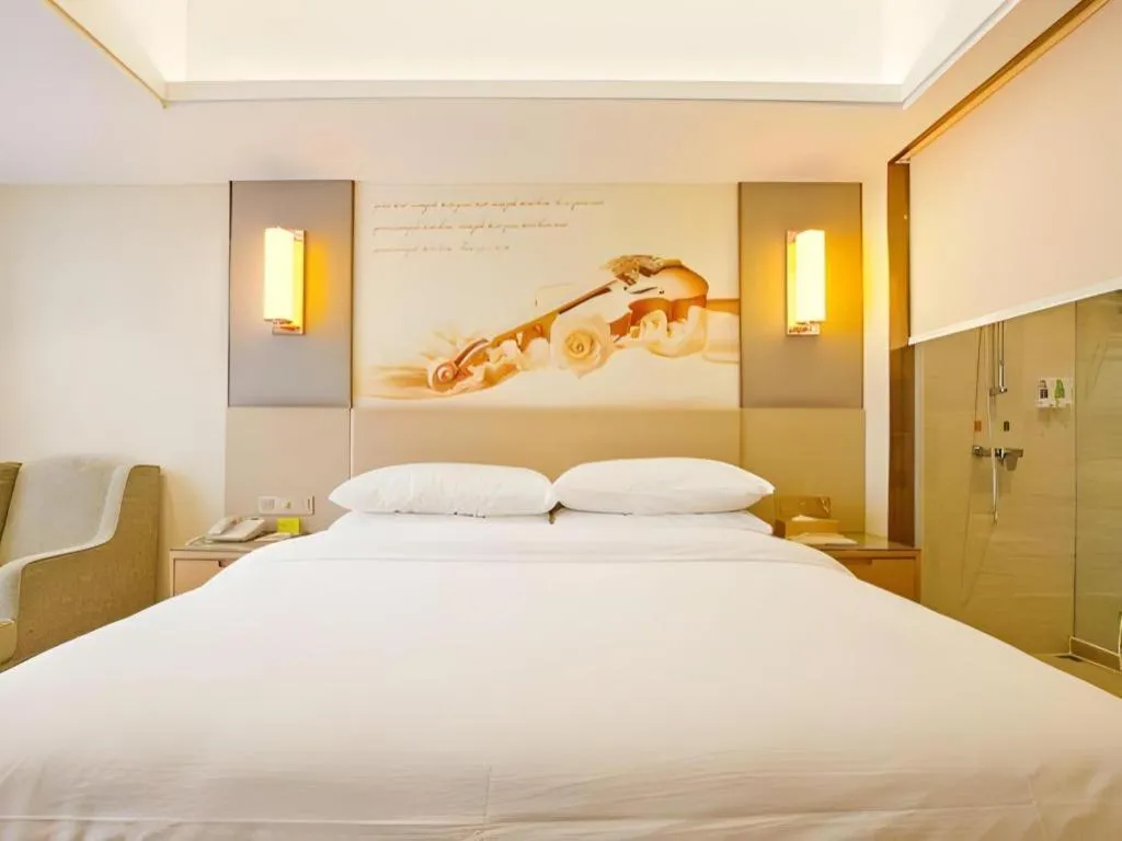 Bed in Vienna Hotel Zhengzhou East High-Speed Railway Station