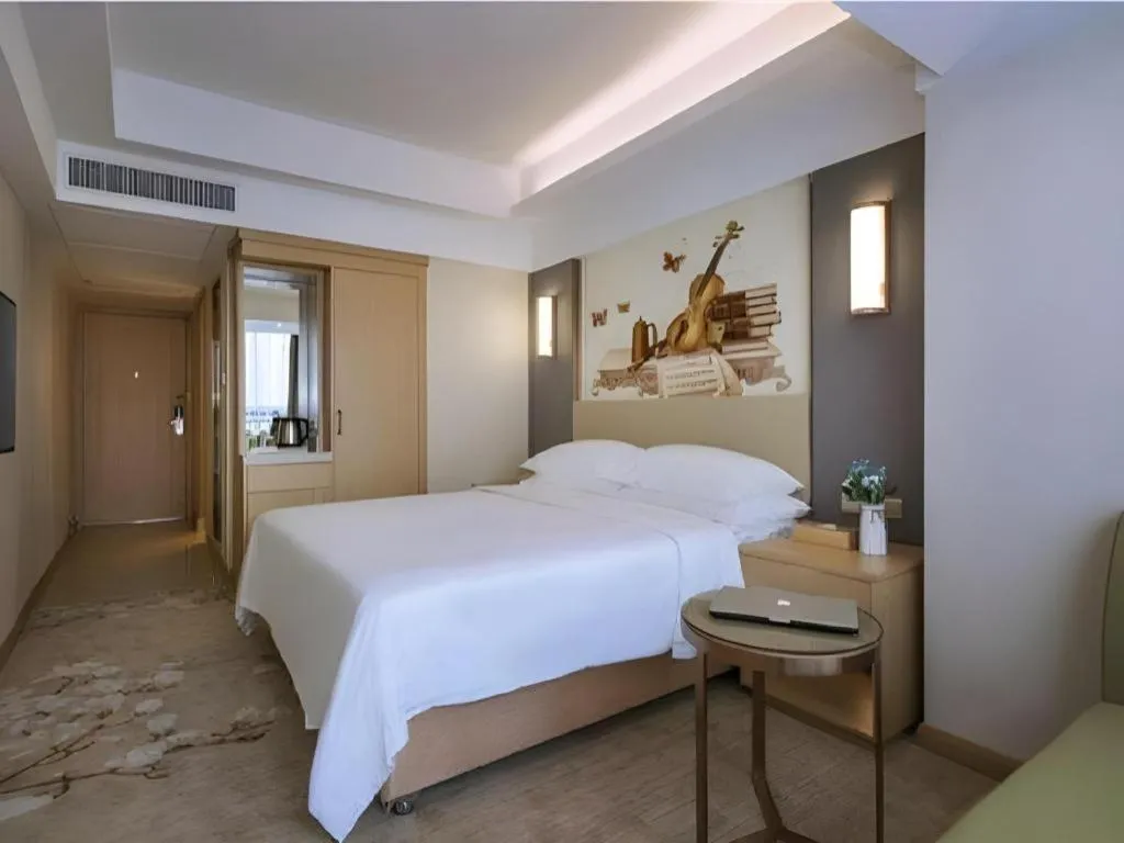 Bed in Vienna Hotel Zhengzhou East High-Speed Railway Station