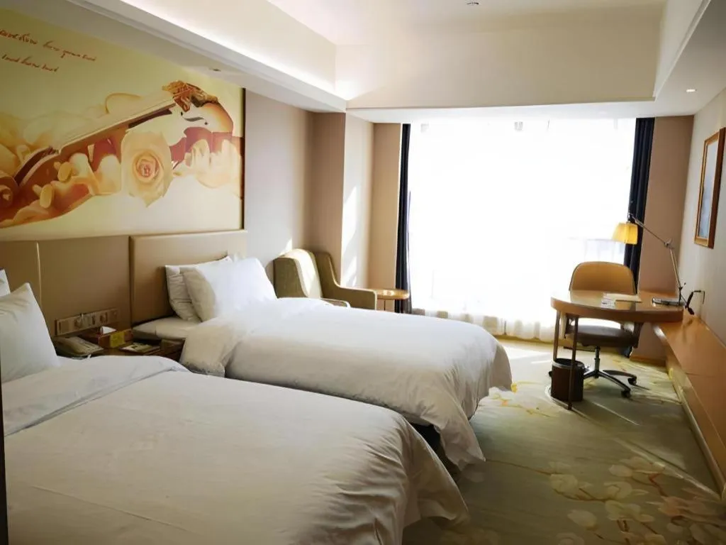 Bed in Vienna Hotel Zhengzhou East High-Speed Railway Station