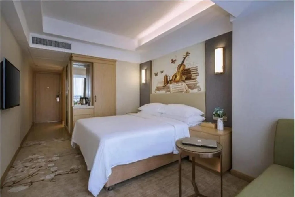 Bed in Vienna Hotel Zhengzhou East High-Speed Railway Station