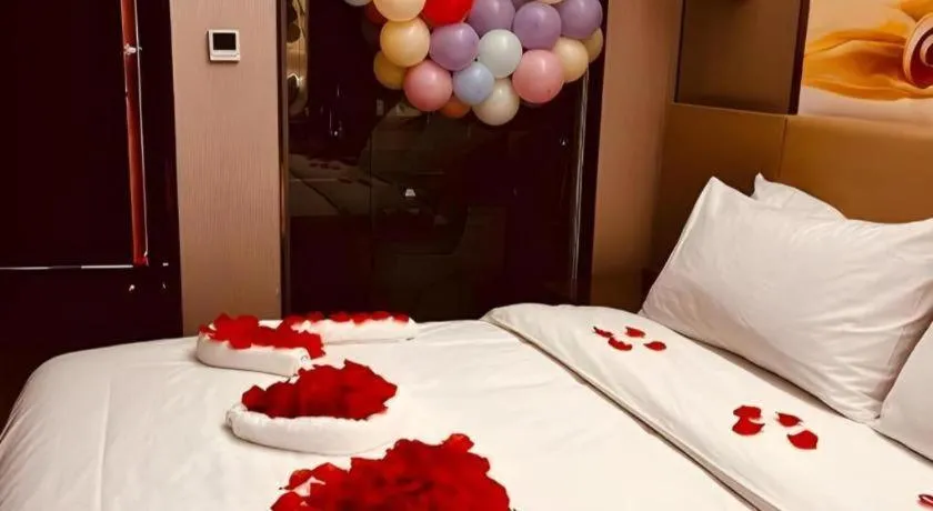 Bed in Vienna Hotel Zhengzhou East High-Speed Railway Station