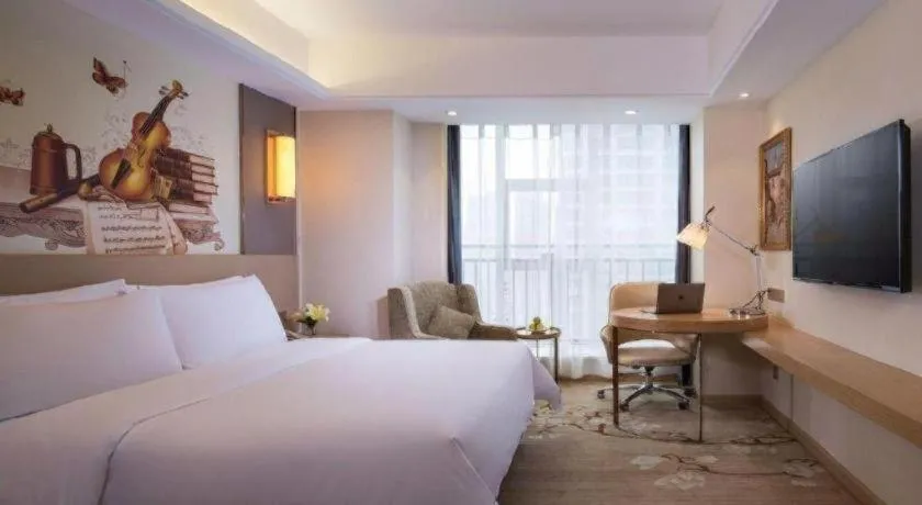 Bed in Vienna Hotel Zhengzhou East High-Speed Railway Station