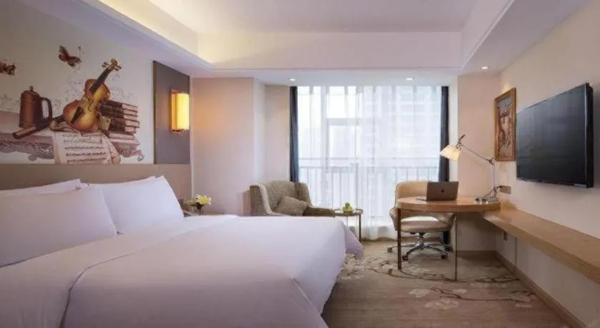 Bed in Vienna Hotel Zhengzhou East High-Speed Railway Station