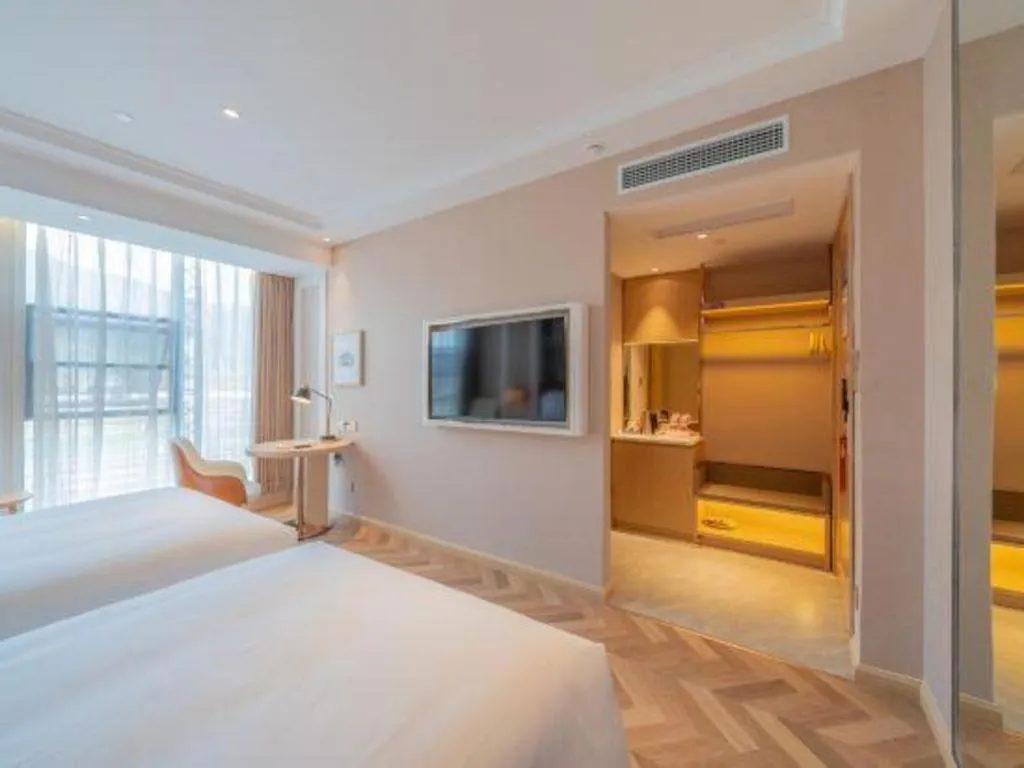 Bed in Vienna Hotel Chongqing West Station Square