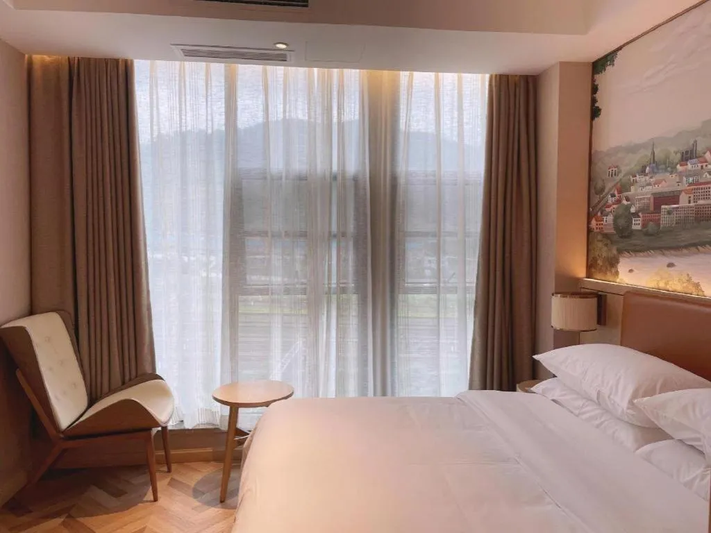 Bed in Vienna Hotel Chongqing West Station Square