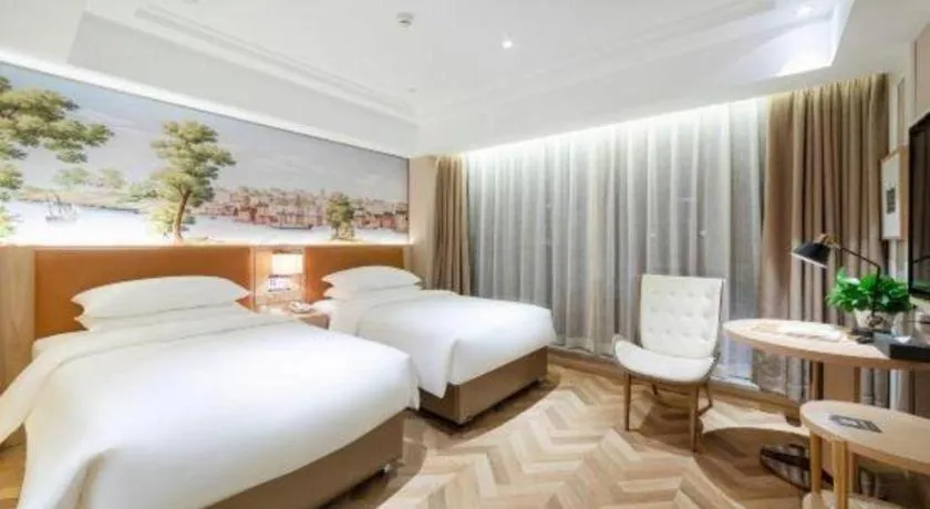 Bed in Vienna Hotel Chongqing West Station Square