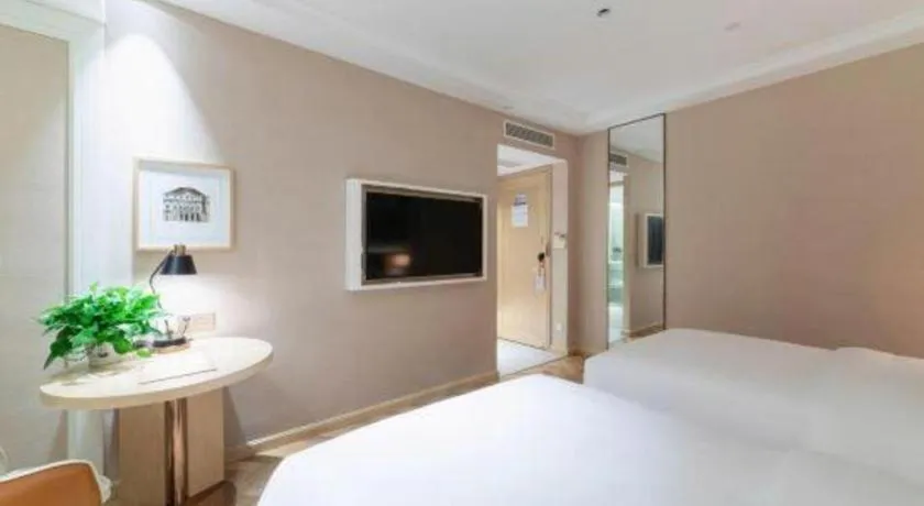 Bed in Vienna Hotel Chongqing West Station Square