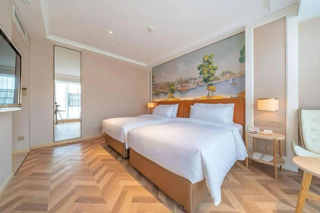 Bed in Vienna Hotel Chongqing West Station Square