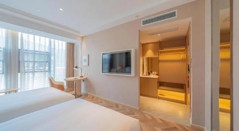 Bed in Vienna Hotel Chongqing West Station Square