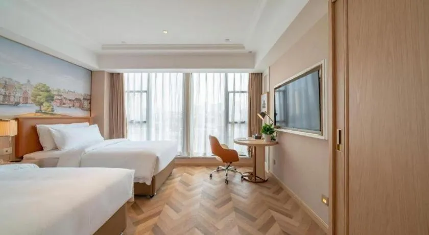 Bed in Vienna Hotel Chongqing West Station Square