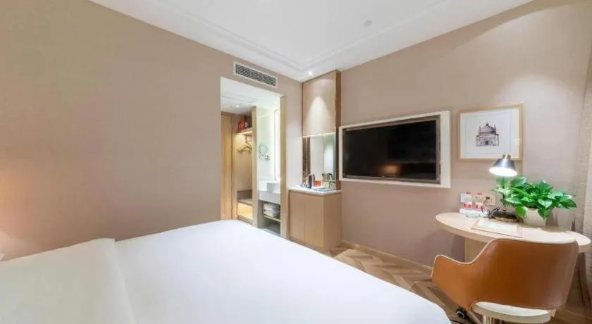 Bed in Vienna Hotel Chongqing West Station Square