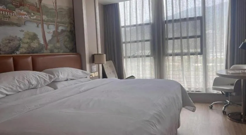 Bed in Vienna Hotel Chongqing West Station Square