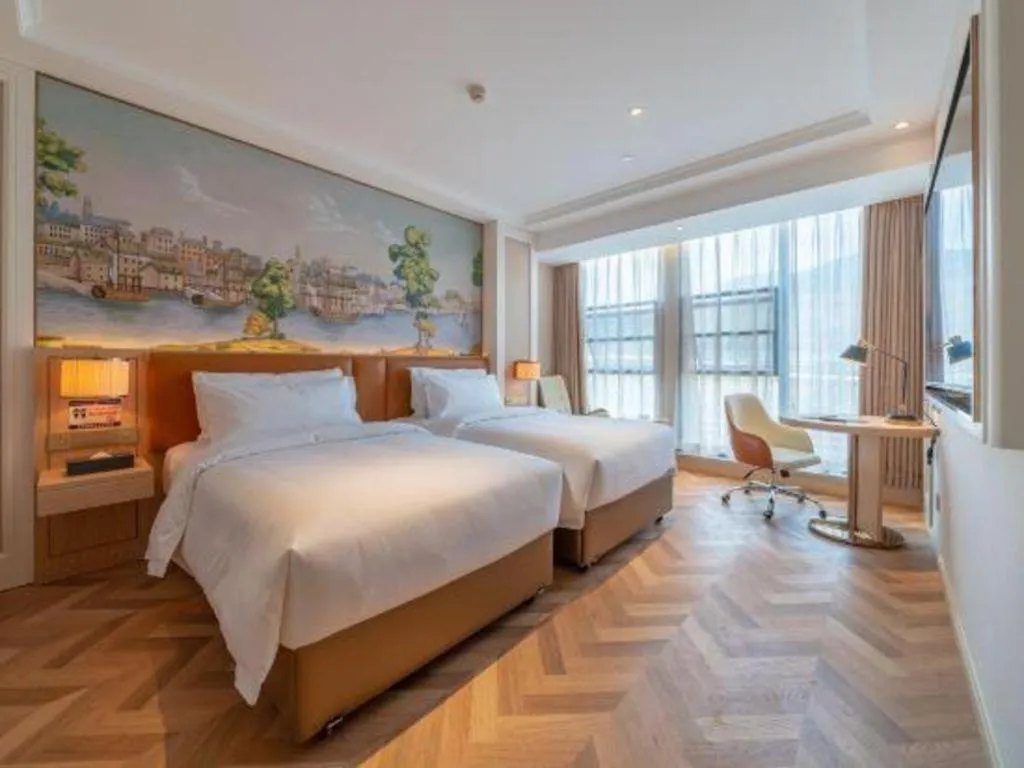 Bed in Vienna Hotel Chongqing West Station Square