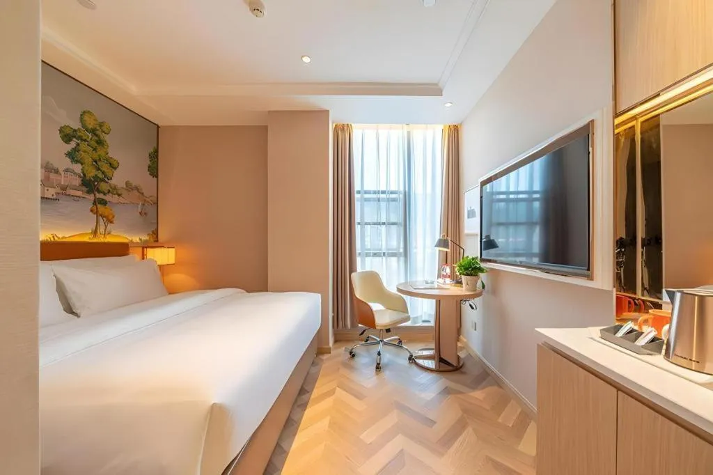 Bed in Vienna Hotel Chongqing West Station Square