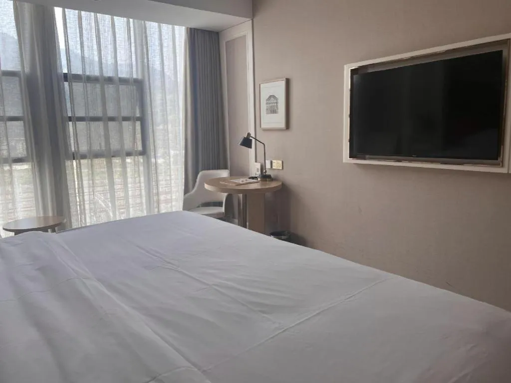 Bed in Vienna Hotel Chongqing West Station Square