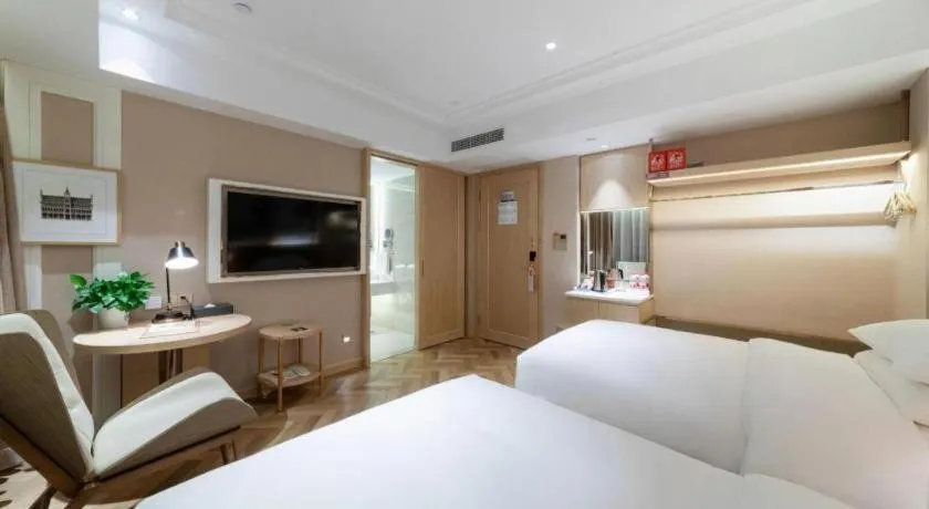 Bed in Vienna Hotel Chongqing West Station Square