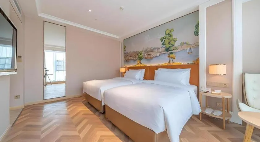 Bed in Vienna Hotel Chongqing West Station Square