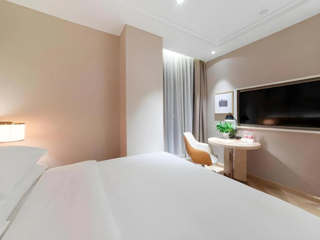 Bed in Vienna Hotel Chongqing West Station Square